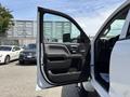 A 2020 Chevrolet Silverado driver's side door is open showcasing the interior door panel and handle