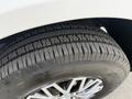 A close-up view of a tire from a 2016 Mercedes-Benz Sprinter showcasing the tread pattern and shiny alloy wheel rim