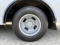 A 2020 Chevrolet Express tire and wheel showcasing a silver rim and black tire with visible tread details