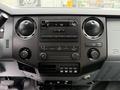 Interior dashboard of a 2015 Ford F-350 SD featuring a control panel with radio climate controls and various buttons for vehicle functions