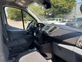Interior view of a 2019 Ford Transit 350 showing the driver's seat dashboard and steering wheel