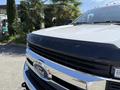 A 2019 Ford F-550 with a prominent grille featuring the Ford logo and the words Super Duty embossed on the hood