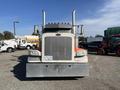 A 2009 Peterbilt Highway truck with a distinctive front design featuring a large grille chrome accents and two tall exhaust stacks