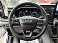 Steering wheel of a 2020 Ford Transit with control buttons and Ford logo in the center