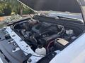 Engine compartment of a 2017 Chevrolet Colorado with various components including hoses wires and a battery clearly visible