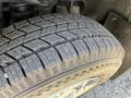 Close-up of a tire from a 2014 Ford F-150 showing detailed tread pattern and design