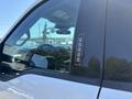 A 2023 Ford F-350 SD with a keypad entry system on the driver's side door