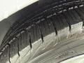 Close-up of a new tire from a 2017 Ford Transit Connect showing tread pattern and surface details