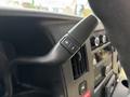 Close-up of a control stalk in a 2020 Chevrolet Express featuring a plus and minus button for adjusting settings