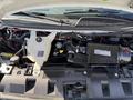 The image shows the engine compartment of a 2017 Chevrolet Express highlighting the engine components and various fluid reservoirs