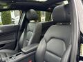 Interior view of a 2016 Mercedes-Benz GLA-250 featuring leather seats and a console between the front seats
