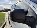 Close-up of the side mirror of a 2018 Ford F-150 showing its black casing and sleek design