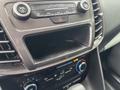 Interior dashboard of a 2019 Ford Transit Connect showing the SYNC system controls with audio buttons and a climate control knob