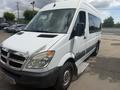 A white 2009 Dodge Sprinter Van with a large windshield side mirrors and a sliding side door