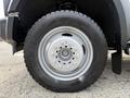 A close-up of a gray wheel and tire from a 2008 Ford F-450 SD with visible tire tread and rim details