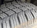 Close-up of a heavy-duty tire tread showing deep grooves and wear patterns on a 2008 Ford F-250 SD tire