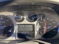 Dashboard of a 2007 Cadillac Escalade displaying the speedometer odometer and fuel gauge with a digital odometer reading 253895 km