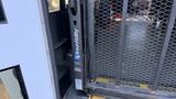 A 2021 Ford Transit wheelchair lift with a BraunAbility logo prominently displayed on the side of the lift mechanism