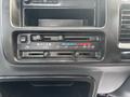 Dashboard controls of a 2010 Daihatsu Hijet with climate control dials and AC settings