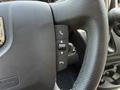 Close-up of the steering wheel of a 2021 RAM Promaster featuring controls for phone and audio settings