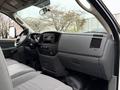 Interior view of a 2008 Sterling Bullet featuring a dashboard with controls and a center console with storage and audio system