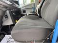 Close-up of a gray fabric seat in a 2022 Lion Lion6 vehicle with visible seat adjustments and controls on the side