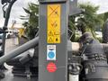 A 2014 Wacker Neuson WL34 loader with safety and operational instruction decals visible on the control panel