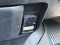 A power outlet located inside a 2020 Ram 2500 vehicle with warning labels indicating electrical hazards