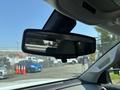 Rearview mirror of a 2017 Chevrolet Colorado with a blurred reflection of the interior visible