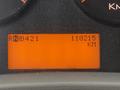 The dashboard display of a 2013 International Durastar 4300 showing an odometer reading of 110215 KM