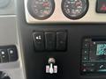 Control panel of a 2020 Lion Lion6 featuring three toggle switches and gauges for air pressure and temperature
