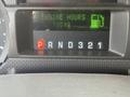 Dashboard display of a 2009 Ford F-550 showing gear selection P R N D 3 2 1 and engine hours 13519 with a fuel icon indicator
