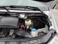 A 2017 Mercedes-Benz Sprinter engine bay showing the engine components including the air intake hose reservoir and various fluid containers