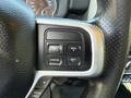 Close-up of the steering wheel controls in a 2020 Ram 2500 featuring buttons for cruise control functions including cancel and set