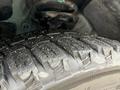 Close-up of a tire from a 2021 Kia Forte showing detailed tread pattern and rubber texture
