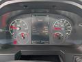 A vehicle dashboard with speedometer tachometer and digital display showing engine info mileage and hours for a 2025 Peterbilt 536