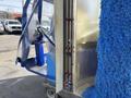 A 2023 Bitimec SC415 car wash machine with blue brushes and a transparent protective covering showcasing its operational features and controls