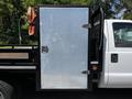 2016 Ford F-550 with a silver metal door on the side of a flatbed truck