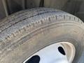 Close-up of a tire from a 2014 International TerraStar showing tread wear and a steel wheel with five circular holes