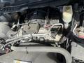 A close-up view of the engine compartment of a 2016 RAM 5500 showing the engine block and various connected components and hoses