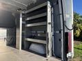 Interior view of a 2024 Mercedes-Benz Sprinter 2500 with metal shelving units installed on one side