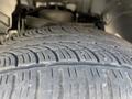 Close-up of a tire on a 2015 RAM 1500 showcasing the tread pattern and surface details