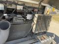 Close-up of the engine compartment of a 2009 Workhorse W62 showing components including a radiator and various engine parts