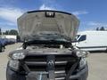 A 2016 RAM 5500 with the hood raised revealing the engine compartment and front grille with a black grille guard attached