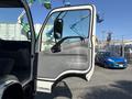 A 2018 Hino 195 truck with the driver's door open showing the interior and dashboard details