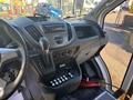 Interior dashboard of a 2017 Ford Transit-350 featuring gear shift radio controls and various buttons