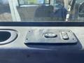Control panel with two buttons for adjusting windows inside a 2014 International 7400 vehicle