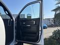 A 2018 RAM 3500 truck door is open showing the interior panel with controls and handles