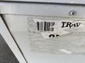 A 2021 Grand Design Recreational ST3478MBS with a partially visible barcode and faded label on the front exterior