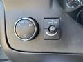 Controls for headlights and dome light in a 2019 GMC Savana including an automatic light setting and dome light off button